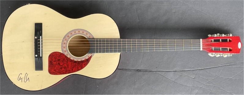 George Clooney Signed Acoustic Guitar Ocean's Eleven JSA Authenticated: George Clooney Signed Acoustic Guitar Ocean's Eleven JSA Authenticated Celebrate cinematic history with this authentic George Clooney autographed acoustic guitar. This instrument features the signatur