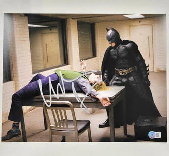 Christian Bale Autographed 11x14 Dark Knight Photo Beckett Authenticated: Christian Bale Autographed 11x14 Dark Knight Photo Beckett Authenticated This striking 11x14 photograph features Christian Bale as Batman from the iconic film "The Dark Knight." The piece is an origin