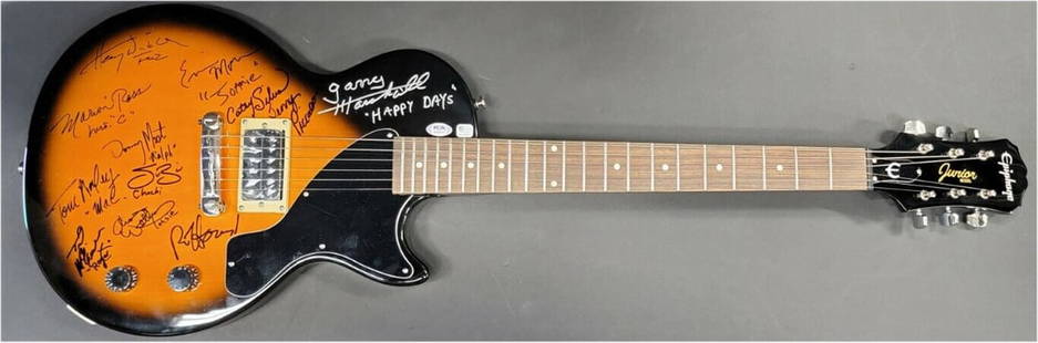 Happy Days Signed Electric Guitar by Full Cast JSA Authenticated: Happy Days Signed Electric Guitar by Full Cast JSA Authenticated This unique electric guitar is a must-have for fans of the classic television show "Happy Days." It features authentic signatures from