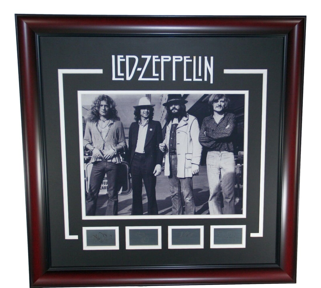 Led Zeppelin 16 x 20 Framed Photo Poster with Etched Autographs: Led Zeppelin 16 x 20 Framed Photo Poster with Etched Autographs This striking framed photograph poster captures the legendary band Led Zeppelin in a classic black and white theme. Measuring 16 x 20 in