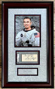 Gene Cernan Signed Framed Display 26.5 x 16 PSA Authenticated Apollo 17: Gene Cernan Signed Framed Display 26.5 x 16 PSA Authenticated Apollo 17 This stunning custom framed display features a cut signature of Gene Cernan, the last astronaut to walk on the moon during the A