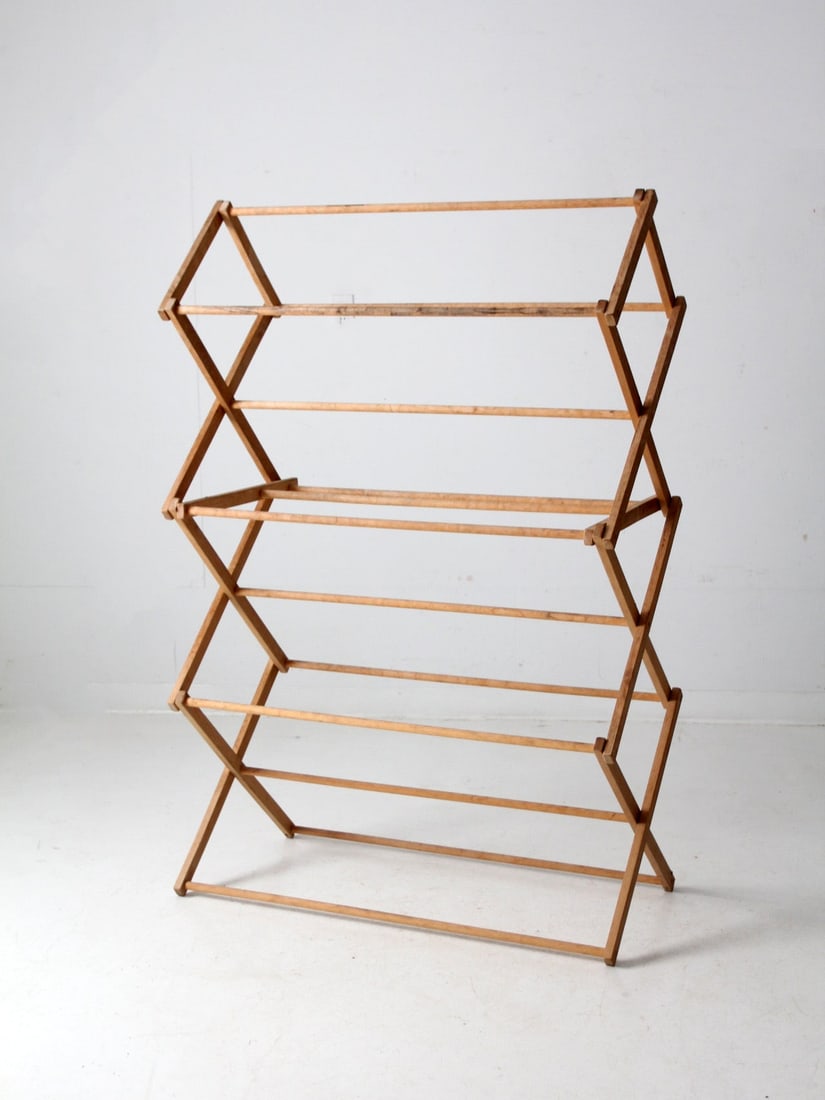 Vintage Collapsible Wooden Drying Rack 60 Inch: Vintage Collapsible Wooden Drying Rack 60 Inch This vintage free-standing drying rack combines functionality with timeless charm. Constructed from wood, it features a sturdy frame and slender wood bar