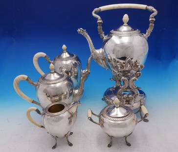 Camusso Gran Paris Sterling Silver 5-Piece Tea Set with Griffin Spouts: Camusso Gran Paris Sterling Silver 5-Piece Tea Set with Griffin Spouts Discover the exquisite Gran Paris 5-Piece Tea Set by Camusso, crafted from high-quality sterling silver. This elegant set feature