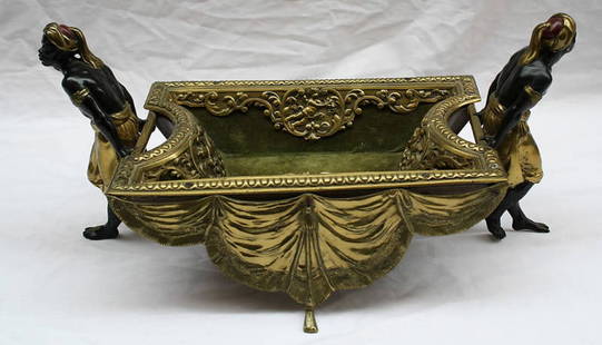 19th Century Austrian Orientalist Patinated Bronze Center Piece: 19th Century Austrian Orientalist Patinated Bronze Center Piece This exquisite 19th century Austrian Orientalist center piece features a detailed depiction of two men carrying a basket. Crafted from p