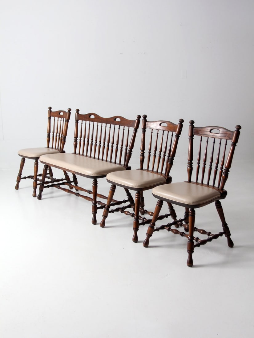 Vintage Windsor Oak Dining Chairs and Bench Set 4 Pieces: Vintage Windsor Oak Dining Chairs and Bench Set 4 Pieces Discover this charming set of vintage dining chairs and bench, crafted from heavy oak and dating back to circa 1970. The set features three Win