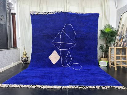 Authentic Handmade Moroccan Berber Wool Rug 9.84 x 6.56 Feet Blue: Authentic Handmade Moroccan Berber Wool Rug 9.84 x 6.56 Feet Blue This authentic and stunning handmade Moroccan Berber wool rug showcases a beautiful soft blue color with a white design at its