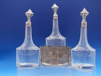 Dutch 830 Silver Hand Engraved 3-Piece Liquor Set with Holder 10 3/4" Tall: Dutch 830 Silver Hand Engraved 3-Piece Liquor Set with Holder 10 3/4" Tall This exquisite 3-piece liquor set features hand-engraved glass bottles with 830 silver tops, showcasing fine craftsmanship