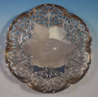 Tiffany & Co. Sterling Silver Serving Plate 10.5" Diameter: Tiffany & Co. Sterling Silver Serving Plate 10.5" Diameter This exquisite sterling silver serving plate, crafted for Tiffany & Co., showcases a stunning pierced and chased wide border. The plate is ma