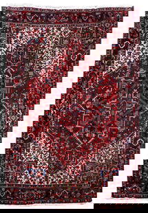 Handcrafted 6'11 x 10'3 Red Persian Heriz Rug Artisan Design: Handcrafted 6'11 x 10'3 Red Persian Heriz Rug Artisan Design This exquisite 6' 11" x 10' 3" Red Persian Heriz Rug is handcrafted by skilled Persian artisans, showcasing traditional Persian designs tha