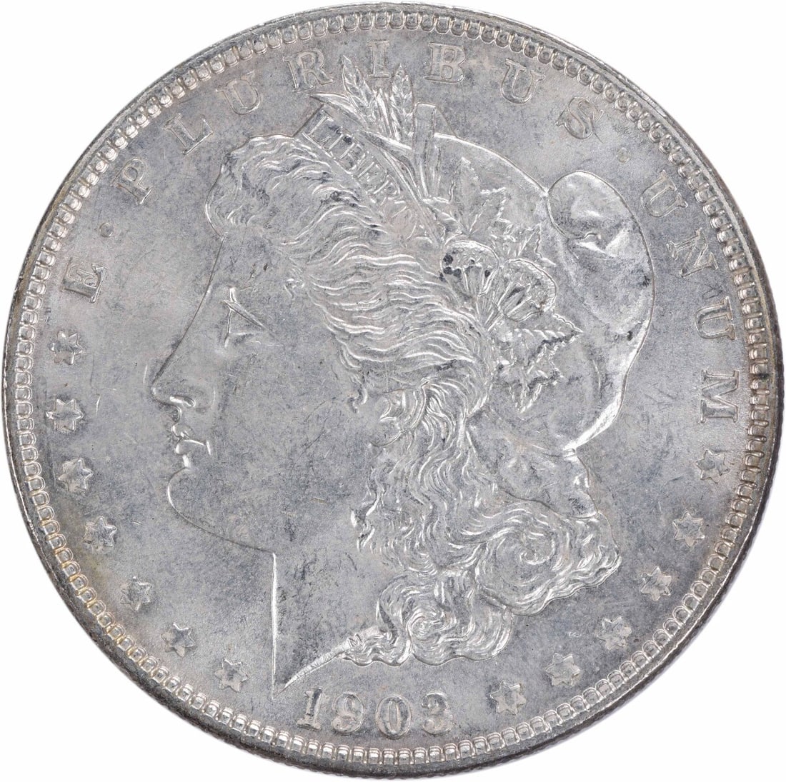 1903 Morgan Silver Dollar BU Uncertified Silver Coin: 1903 Morgan Silver Dollar BU Uncertified Silver Coin This 1903 Morgan Silver Dollar is a beautiful example of U.S. coinage, showcasing the classic design that has made it a favorite among collectors.