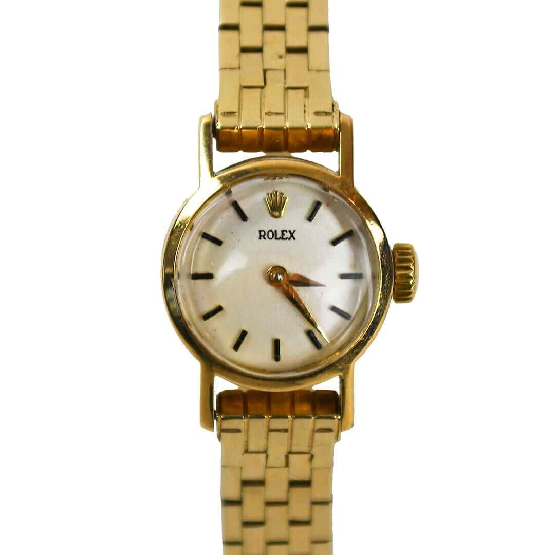 Vintage Rolex 18K Yellow Gold Wristwatch with 13K Bracelet: Vintage Rolex 18K Yellow Gold Wristwatch with 13K Bracelet This exquisite vintage Rolex watch features an 18K yellow gold case and a 13K yellow gold bracelet, embodying classic elegance. The round cas