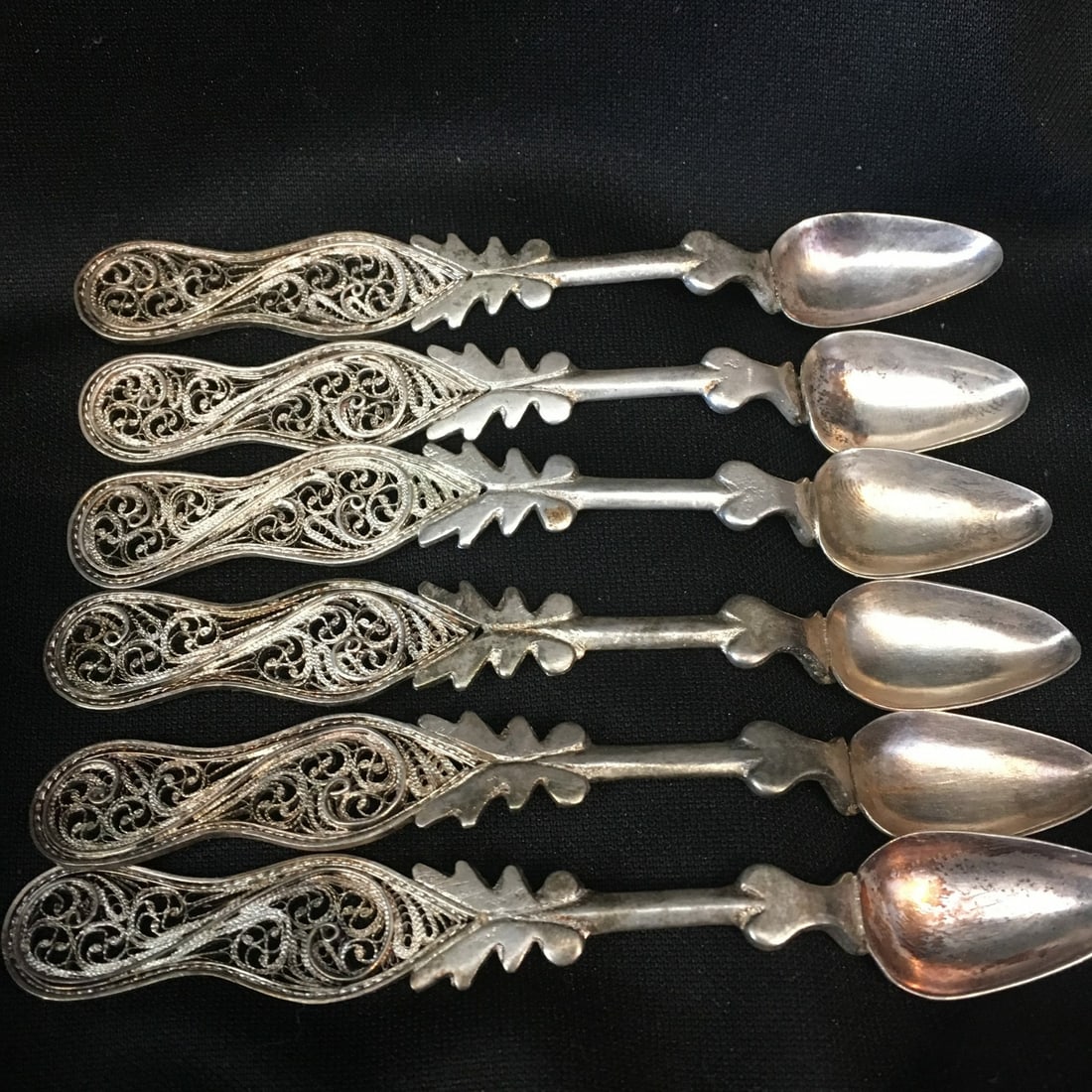 Set of 6 Antique .800 Silver Filigree Demitasse Spoons 4.25 Inches: Set of 6 Antique .800 Silver Filigree Demitasse Spoons 4.25 Inches This exquisite set of six .800 silver filigree demitasse spoons, dating back to the early 20th century, showcases intricate craftsman