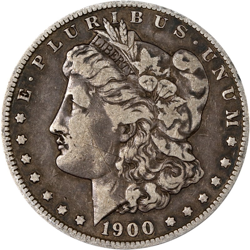 1900-O/CC Uncertified Morgan Silver Dollar Coin: 1900-O/CC Uncertified Morgan Silver Dollar Coin This 1900-O/CC Morgan Silver Dollar features a striking design and is a notable piece for any coin collector. The coin is made of silver with a fineness