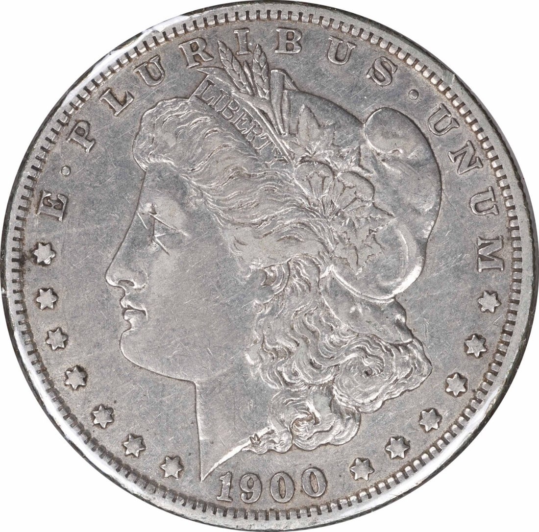 1900-O/CC VAM 9 Morgan Silver Dollar 90% Silver XF Coin: 1900-O/CC VAM 9 Morgan Silver Dollar 90% Silver XF Coin This 1900-O/CC VAM 9 Morgan Silver Dollar features a classic design by George T. Morgan and is composed of 90% silver and 10% copper. The coin h