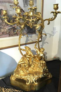 19th Century Louis XV Gilded Bronze Candelabrum 31.5 x 18 x 9 Inches: 19th Century Louis XV Gilded Bronze Candelabrum 31.5 x 18 x 9 Inches This exquisite Louis XV-style candelabrum is a remarkable piece from the 19th century, showcasing a stunning gold gilded bronze fin