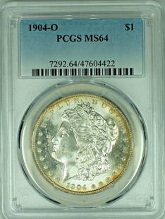 1904-O Morgan Silver Dollar Coin PCGS MS 64 Toned Silver: 1904-O Morgan Silver Dollar Coin PCGS MS 64 Toned Silver This 1904-O Morgan Silver Dollar is a stunning piece from the renowned Morgan coin series. Graded MS 64 by PCGS, this uncirculated coin