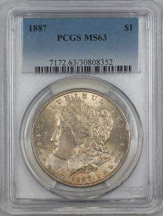 1887 Morgan Silver Dollar PCGS MS63 Toned Coin Uncirculated: 1887 Morgan Silver Dollar PCGS MS63 Toned Coin Uncirculated This 1887 Morgan Silver Dollar is a stunning piece, certified by PCGS with a grade of MS 63, indicating its uncirculated condition. Minted