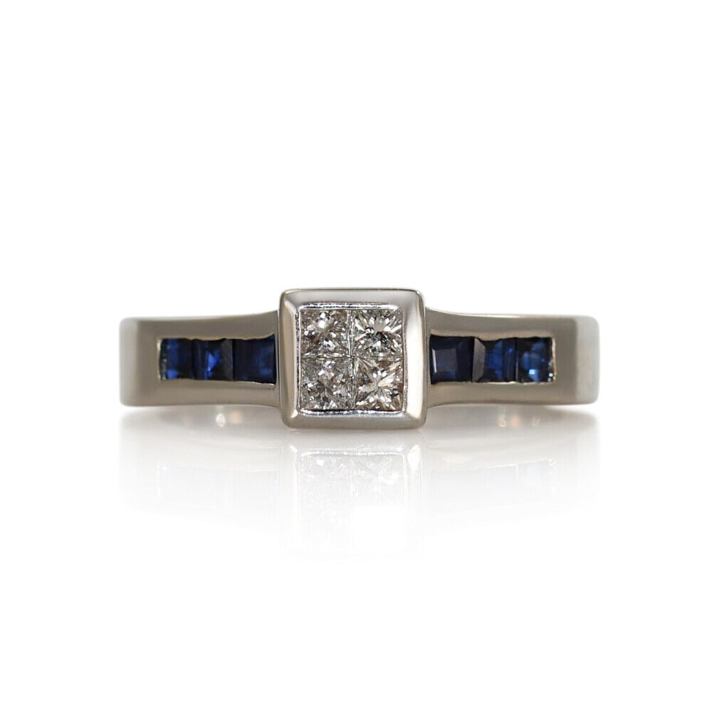 14K White Gold Ladies Ring with Diamonds and Sapphires Size 7: 14K White Gold Ladies Ring with Diamonds and Sapphires Size 7 This exquisite ring features a stunning combination of diamonds and sapphires set in a luxurious 14K white gold band. The ring is designed