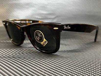 Ray-Ban RB2140 902 Tortoise Wayfarer Polarized Sunglasses: Ray-Ban RB2140 902 Tortoise Wayfarer Polarized Sunglasses Experience timeless style with the Ray-Ban RB2140 902 tortoise square sunglasses. These unisex shades feature polarized lenses crafted from