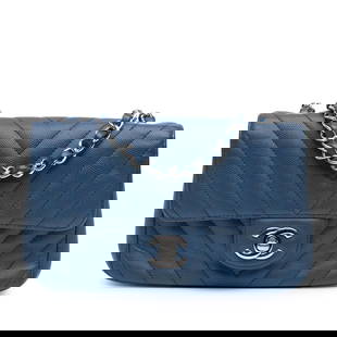 Chanel Mini Classic Chevron Caviar Leather Flap Bag Blue: Chanel Mini Classic Chevron Caviar Leather Flap Bag Blue The Chanel Mini Rectangular Classic Chevron Caviar Single Flap bag showcases a stunning quilted caviar leather exterior in a sophisticated blue