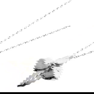 Tiffany & Co. Women's Silver Poinsettia Pendant Necklace: Tiffany & Co. Women's Silver Poinsettia Pendant Necklace This exquisite Tiffany & Co. Poinsettia Necklace is crafted from high-quality silver, designed specifically for women. The necklace features