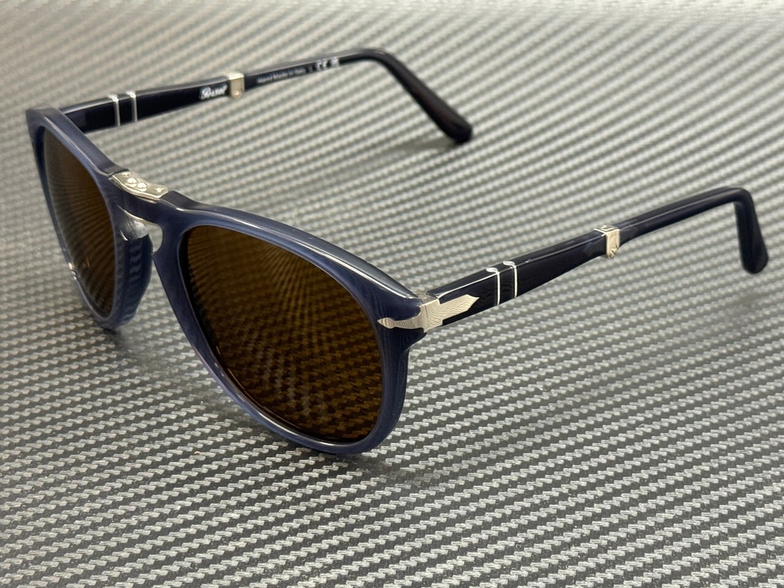 Persol PO0714 Blue Frame 54mm Unisex Sunglasses: Persol PO0714 Blue Frame 54mm Unisex Sunglasses Experience style and functionality with these Persol PO0714 sunglasses. Designed for both men and women, these sunglasses feature a striking blue frame