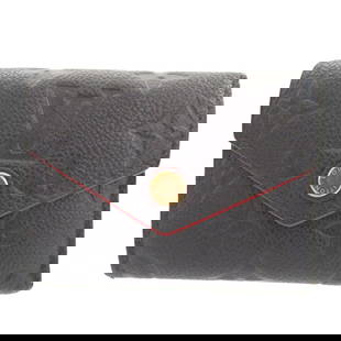 Louis Vuitton Monogram Empreinte Portefeuille Zoe M58880 Navy Wallet: Louis Vuitton Monogram Empreinte Portefeuille Zoe M58880 Navy Wallet Introducing the Louis Vuitton Monogram Empreinte Portefeuille Zoe M58880 in Navy, a stylish and functional bi-fold wallet designed