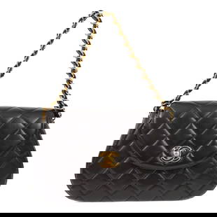 Chanel Black Lambskin Quilted Top Handle Handbag: Chanel Black Lambskin Quilted Top Handle Handbag This Chanel Black Lambskin Chain Handbag is a classic accessory that combines elegance with practicality. Crafted from luxurious lambskin, it