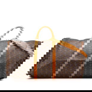Louis Vuitton Monogram Keepall Bandouliere 60 Travel Bag: Louis Vuitton Monogram Keepall Bandouliere 60 Travel Bag The Louis Vuitton Monogram Keepall Bandouliere 60 is a stylish and practical travel bag crafted from durable monogram canvas with vachetta leat