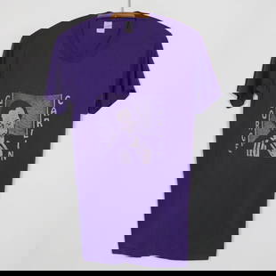 1980s George Carlin Simon Says Vintage Purple Shirt: 1980s George Carlin Simon Says Vintage Purple Shirt Presenting a true vintage 1980s George Carlin 'Simon Says Go Fuck Yourself' shirt. This unique piece features striking front and back graphics, embo