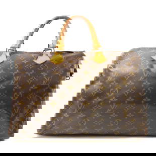 LOUIS VUITTON Speedy 35 Monogram Handbag Brown PVC Canvas GHW: LOUIS VUITTON Speedy 35 Monogram Handbag Brown PVC Canvas GHW This LOUIS VUITTON Speedy 35 Handbag is a classic accessory crafted from durable PVC coated canvas in a rich brown color. The bag features