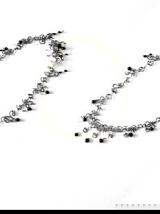 Vintage Filigree Black Bead Choker Necklace and Bracelet: Vintage Filigree Black Bead Choker Necklace and Bracelet This vintage choker necklace showcases an elegant filigree style chain adorned with black beads, complemented by a convenient hook closure. Ver