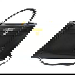 HERMES Kelly 32 Black Box Calf Leather Handbag 22cm x 32cm x 12cm: HERMES Kelly 32 Black Box Calf Leather Handbag 22cm x 32cm x 12cm This exquisite HERMES Kelly 32 Handbag is crafted from luxurious box calf leather in a classic black color. Designed for women, it fea