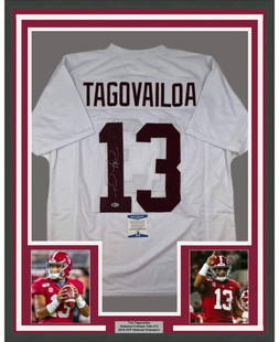 Framed Signed Tua Tagovailoa Alabama Jersey with Beckett COA: Framed Signed Tua Tagovailoa Alabama Jersey with Beckett COA This framed autographed jersey features Tua Tagovailoa, a standout athlete from the Alabama Crimson Tide. This original piece is