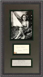 Maureen O'Sullivan Signed Display 24" x 14" Framed with BAS Authentication: Maureen O'Sullivan Signed Display 24" x 14" Framed with BAS Authentication This museum-quality display features a cut signature from actress Maureen O'Sullivan, renowned for portraying Jane Parker in