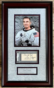 Gene Cernan Signed Framed Display 26.5 x 16 PSA Authenticated Apollo 17: Gene Cernan Signed Framed Display 26.5 x 16 PSA Authenticated Apollo 17 This stunning custom framed display features a cut signature of Gene Cernan, the last astronaut to walk on the moon during the A