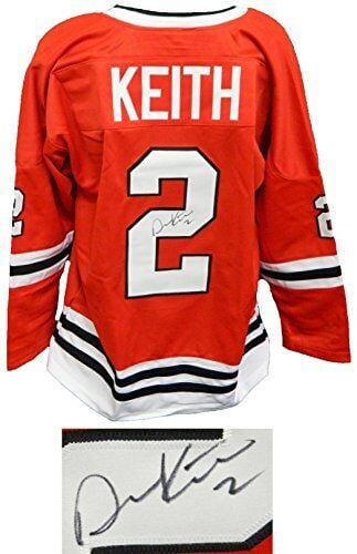 Duncan Keith Signed Red Custom Hockey Jersey with COA: Duncan Keith Signed Red Custom Hockey Jersey with COA This is a signed red custom hockey jersey by Duncan Keith, a celebrated player in the NHL. The jersey is an original item, size XL, and comes with