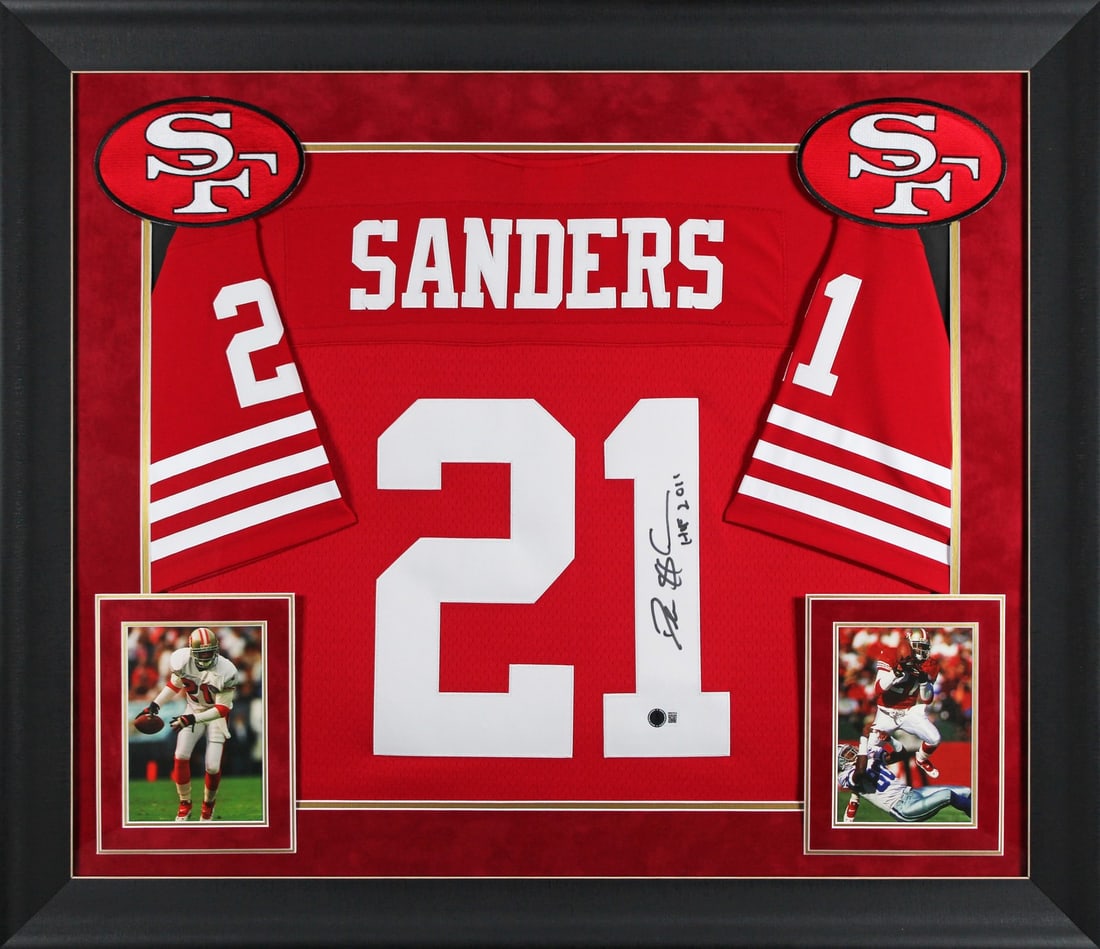 Deion Sanders Signed 49ers HOF 2011 Red Jersey Framed BAS Authenticated: Deion Sanders Signed 49ers HOF 2011 Red Jersey Framed BAS Authenticated Celebrate the legacy of Deion Sanders with this authentic, signed San Francisco 49ers red Mitchell & Ness throwback jersey. Insc