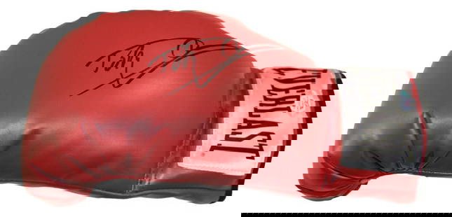 Dolph Lundgren Signed Rocky IV Captain Ivan Drago Boxing Glove PSA/DNA: Dolph Lundgren Signed Rocky IV Captain Ivan Drago Boxing Glove PSA/DNA This boxing glove, signed by Dolph Lundgren, features the iconic character 'Captain Ivan Drago' from the movie Rocky IV. The auto