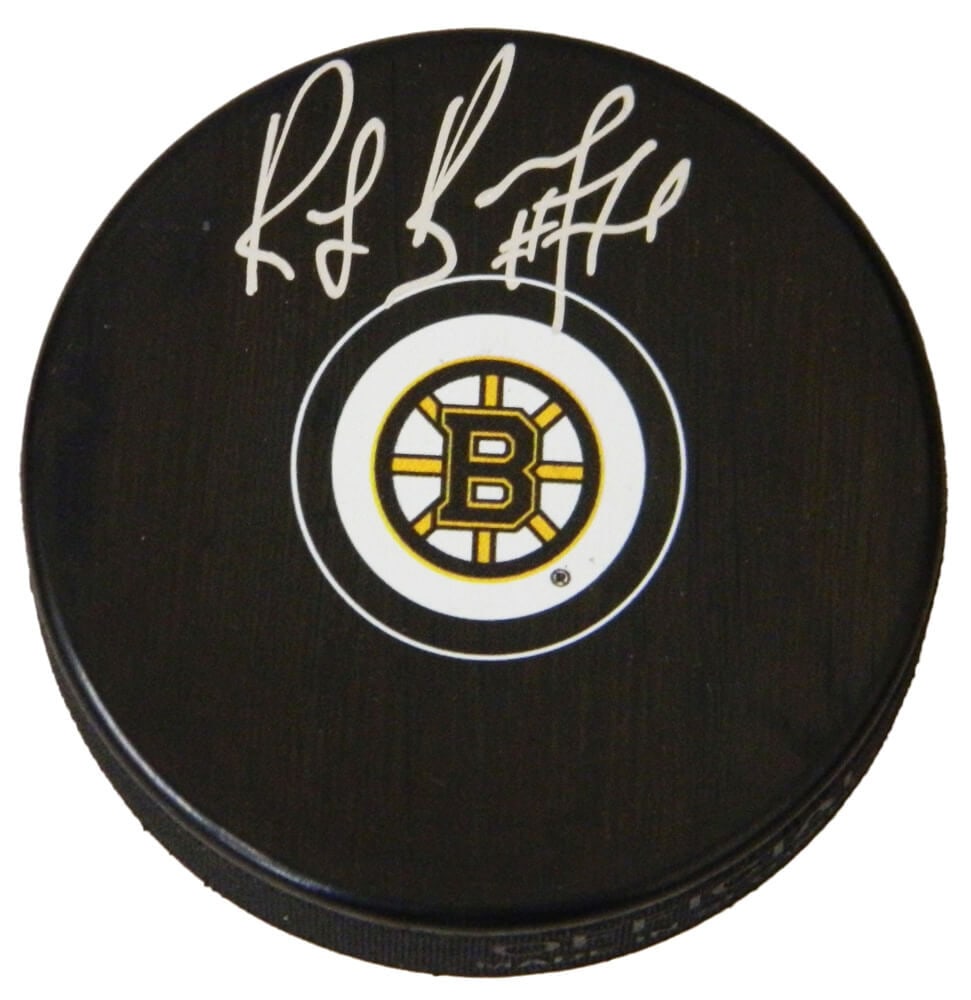 Ray Bourque Signed Boston Bruins NHL Puck with Certificate of Authenticity: Ray Bourque Signed Boston Bruins NHL Puck with Certificate of Authenticity This Boston Bruins NHL logo hockey puck is signed by Ray Bourque, a legendary player and Hall of Famer. The puck is an origin