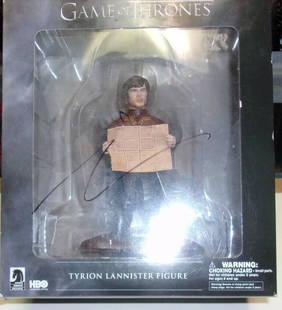 Peter Dinklage Tyrion Lannister Signed Action Figure with Hologram: Peter Dinklage Tyrion Lannister Signed Action Figure with Hologram This is a pre-owned action figure of Tyrion Lannister, portrayed by Peter Dinklage in the acclaimed series Game of Thrones. The figur