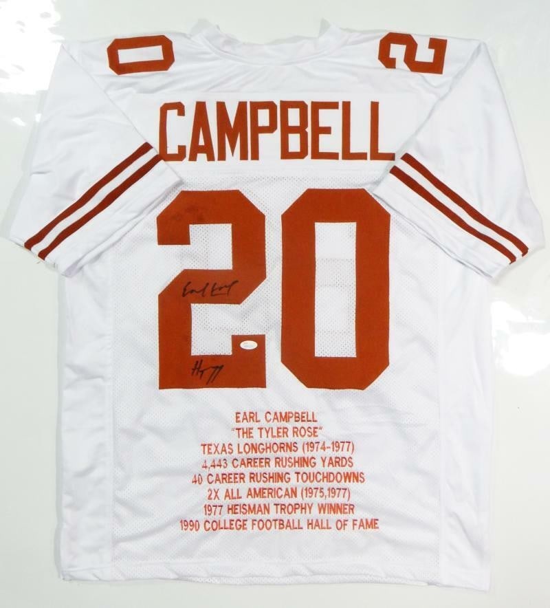 Earl Campbell Autographed White College Football Jersey JSA Authenticated: Earl Campbell Autographed White College Football Jersey JSA Authenticated This is an original autographed white college jersey featuring Earl Campbell, a celebrated football player. The jersey comes w