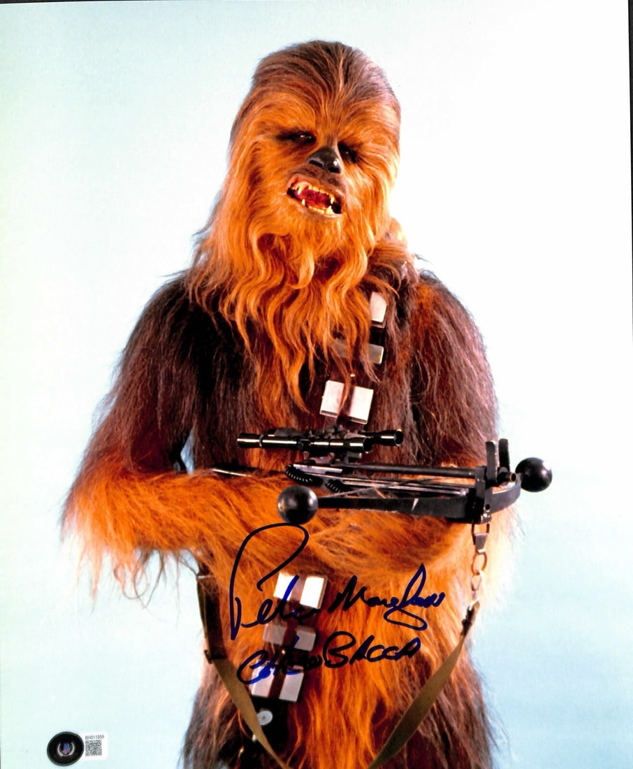 Peter Mayhew Chewbacca Signed 11x14 Photo with Beckett COA: Peter Mayhew Chewbacca Signed 11x14 Photo with Beckett COA This stunning 11x14 photograph features Peter Mayhew's autograph, who famously portrayed Chewbacca in the Star Wars saga. The photograph is s