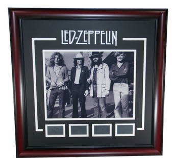 Led Zeppelin 16 x 20 Framed Photo Poster with Etched Autographs: Led Zeppelin 16 x 20 Framed Photo Poster with Etched Autographs This striking framed photograph poster captures the legendary band Led Zeppelin in a classic black and white theme. Measuring 16 x 20 in