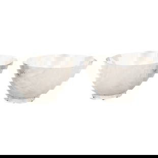 Tiffany & Co Sterling Silver Mid-Century Bowls Set of 2 4x6 in: Tiffany & Co Sterling Silver Mid-Century Bowls Set of 2 4x6 in Presenting a stunning pair of sterling silver bowls from Tiffany & Co., elegantly designed in the Mid-Century modern style. These bowls s