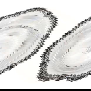 Sterling Silver Art Nouveau Bowl: Sterling Silver Art Nouveau Bowl This exquisite sterling silver bowl, crafted by the esteemed Tiffany & Co., showcases a beautiful Art Nouveau design surrounding its scalloped rim. Each of the seven p