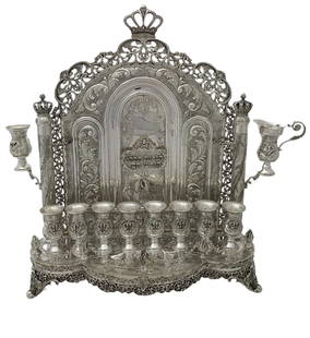 Ornate 925 Sterling Silver Handmade Leaf Menorah 19.50" x 18": Ornate 925 Sterling Silver Handmade Leaf Menorah 19.50" x 18" This exquisite menorah is crafted from fine 925 sterling silver, showcasing a stunning handmade leaf applique design with chased floral