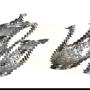 19th Century Silver Plated Tea Set with Foliate Engraving Set of 2: 19th Century Silver Plated Tea Set with Foliate Engraving Set of 2 This exquisite two-piece antique silver plated tea set features intricate foliate engraving, reflecting the craftsmanship of the 19th