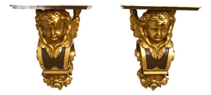 Elegant Pair of Cherub Gold Leaf Wall Sconce Shelves: Elegant Pair of Cherub Gold Leaf Wall Sconce Shelves This exquisite pair of cherub wall sconce shelves features ornate carved details with a beautiful gold leaf finish. Manufactured approximately 25 y