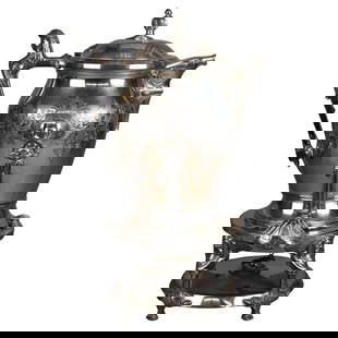 Antique C1890 Silver Plated Tilting Tea Pot with Mask Engraving: Antique C1890 Silver Plated Tilting Tea Pot with Mask Engraving This exquisite antique figural tilting tea pot, crafted around 1890, showcases stunning mask and foliate engravings. Made of silver plat